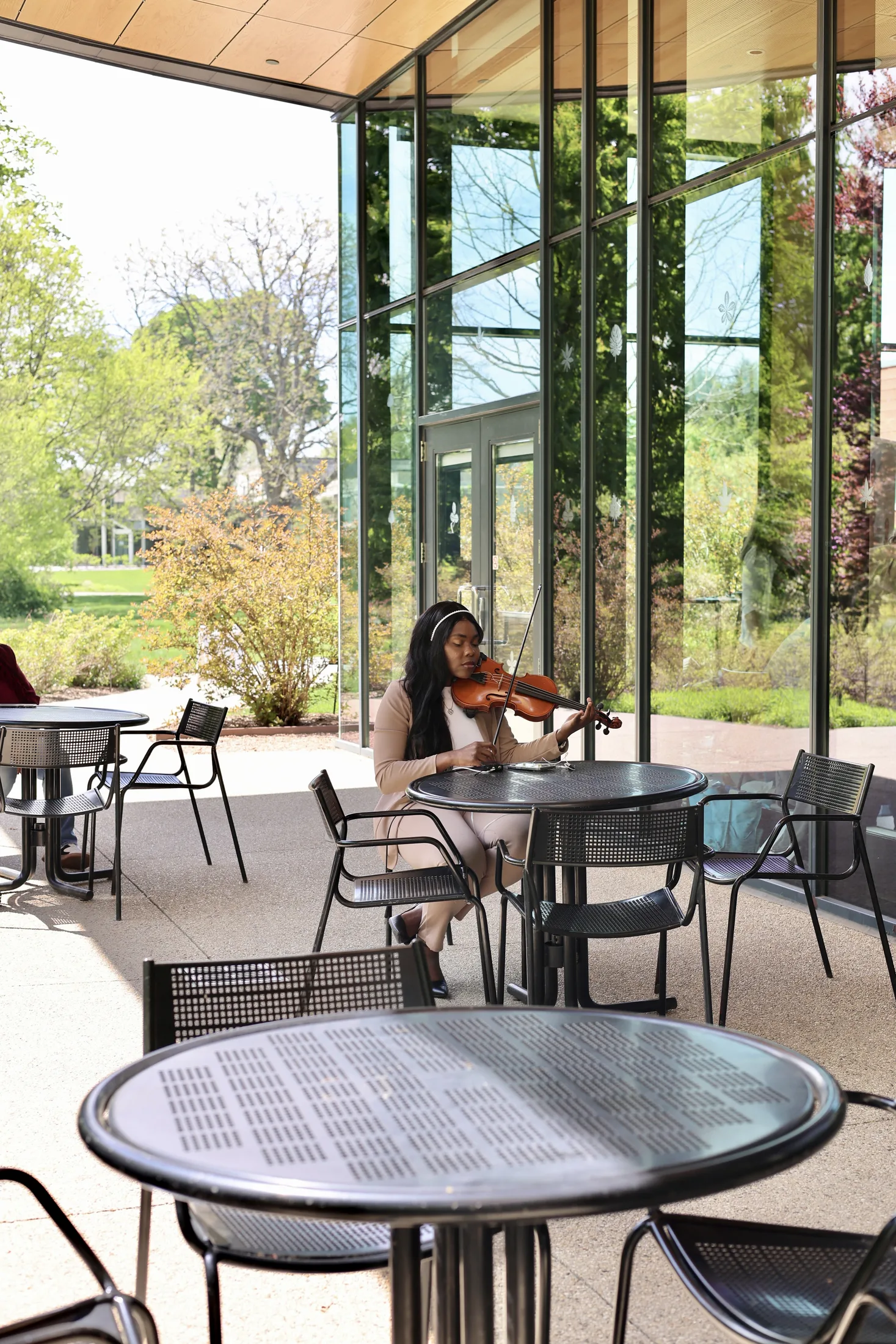 Violinist performing outside the Reclaim 13 event venue
