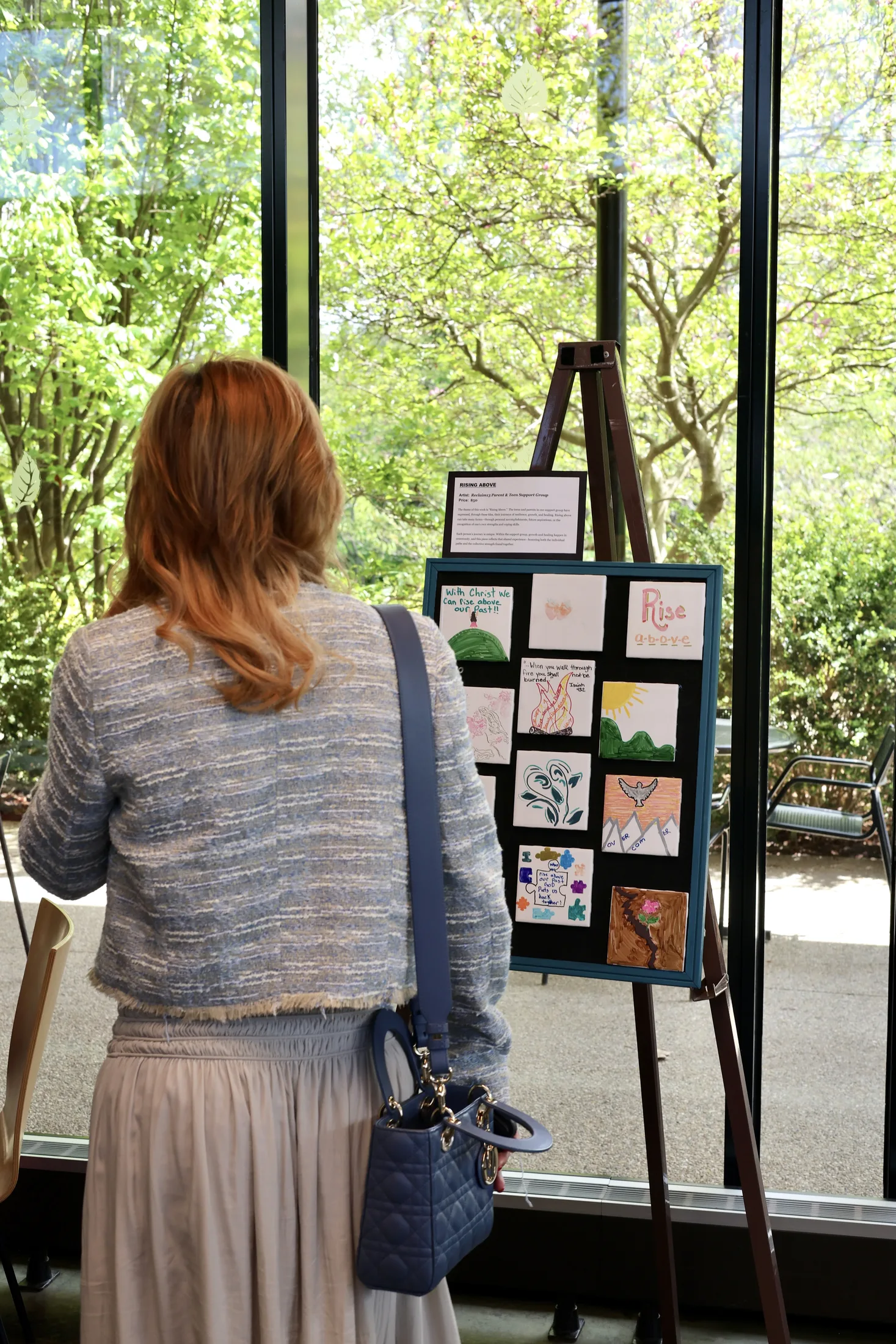 Guest viewing artwork at the Reclaim 13 event